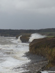LZ00676 Waves crashing against cliffs at Llantwit Major beach.jpg